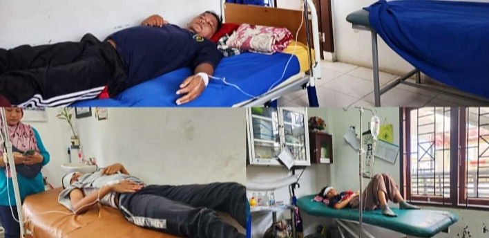 Teks foto: 1 keluarga kecuali ibu rumah tangga yang mendapatkan perawatan di Puskesmas Lima Puluh diduga terjangkit DBD.